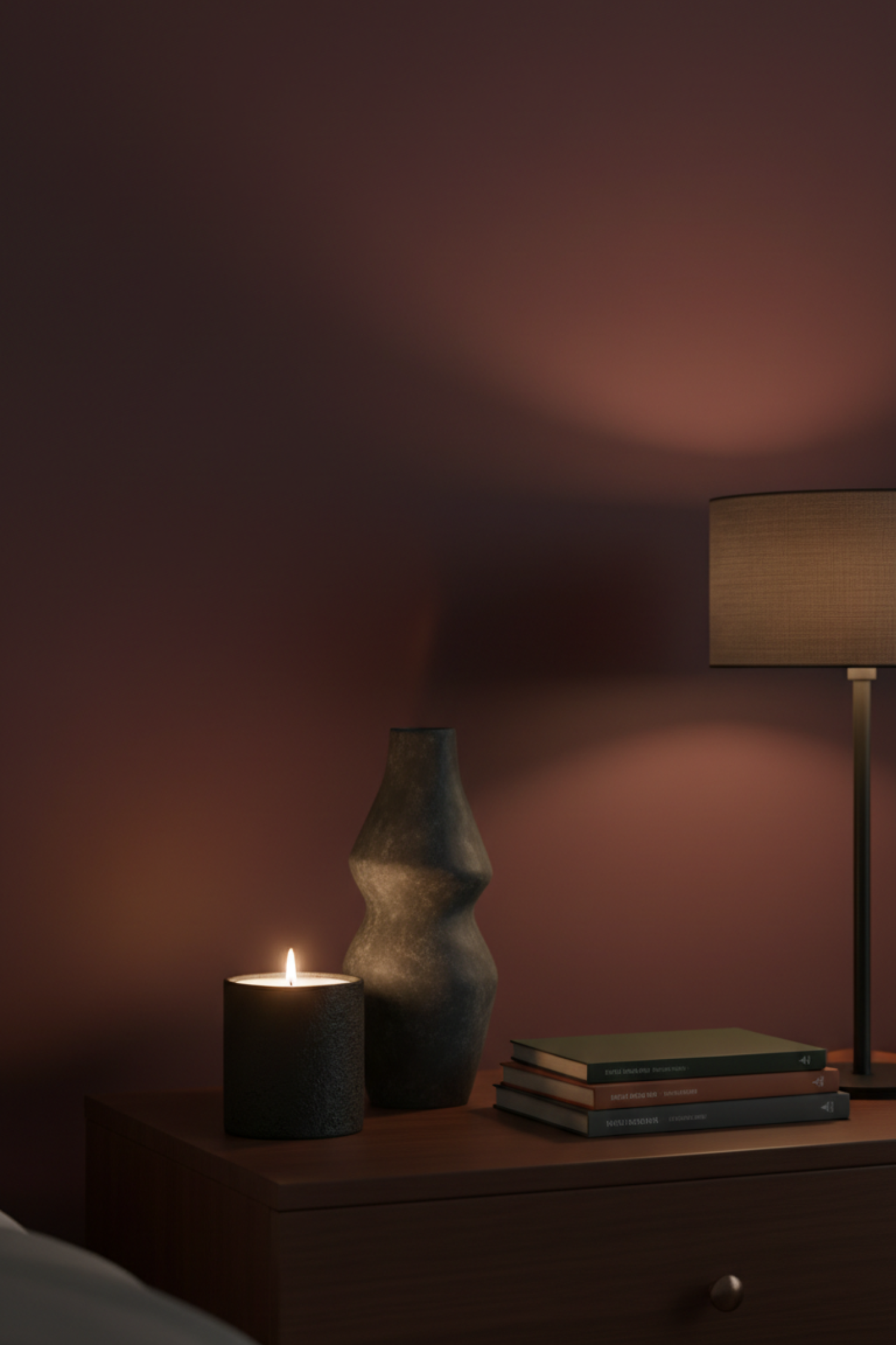 Curated candles sculptural objects and vintage finds styled on a bedroom dresser